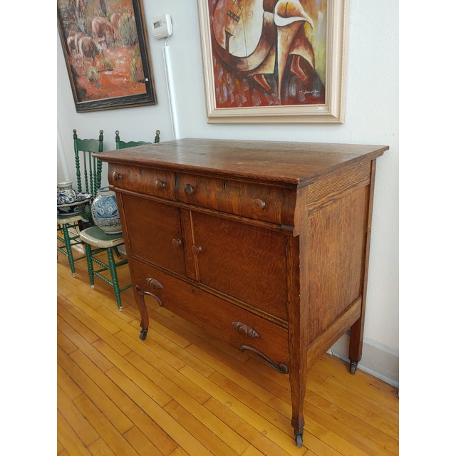 Here's a sweet diminutive sideboard that is perfect for smaller spaces. Early 20th Century Quarter sawn oak that has...