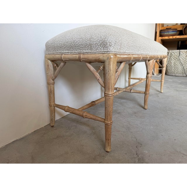 This elegant vintage Hollywood Regency style bench features a beautifully crafted faux bamboo carved wood frame with...