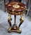 Elevate your interior with the timeless grandeur of this French Empire-inspired round side table, meticulously handcrafted...