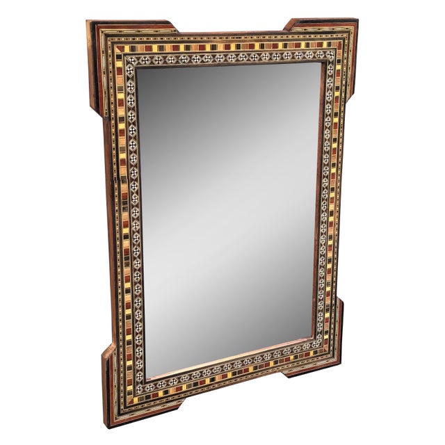 An exquisite mid 20th century mirror showcasing traditional mosaic inlay craftsmanship. The wooden frame is meticulously...