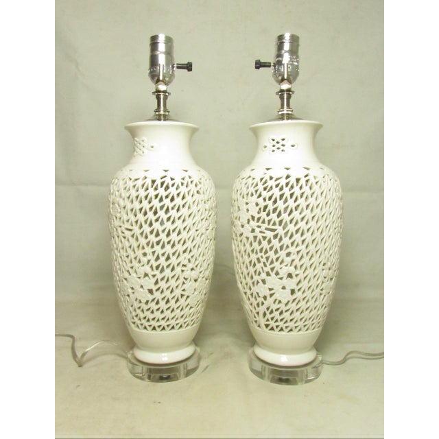 Pair of Chinese Blanc de Chine pierced porcelain lamps, c.1970’s A tall pair of lamps with a geometric pattern pierced...