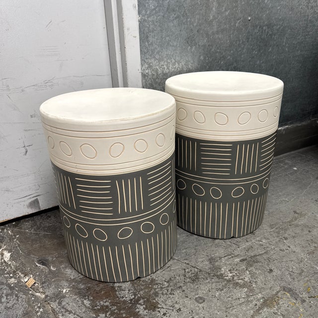 Design Plus Gallery presents a Pair of the Hieroglyphics Garden Stools from Uttermost. Each cylindrical terracotta form is...