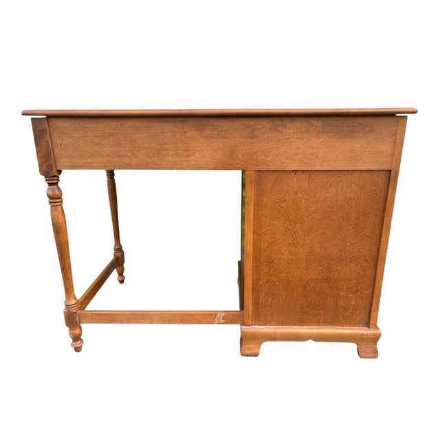A vintage Early American Traditional or Chippendale style writing desk by Ethan Allen. Constructed of solid maple and...