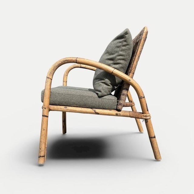 Lounge chair attributed to adrien audoux & frida minet, produced in france during the mid-20th century. the chair features...