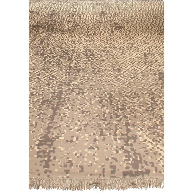 Inspired by the layered beauty of ancient stonework and digital textures, the "Petra Design" wool rug presents a...