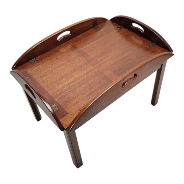 Original 1960s Butler solid mahogany coffee table in Chippendale style. Features a removable tray top with raised edges...