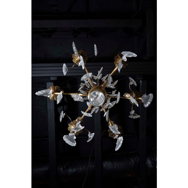 A French six-light crystal chandelier from the late 19th century, with brass armature and crystal column. Born in France...