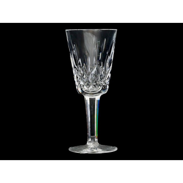 A beautiful set of four authentic Waterford Crystal petite wine or sherry stems in the iconic Lismore pattern. The...