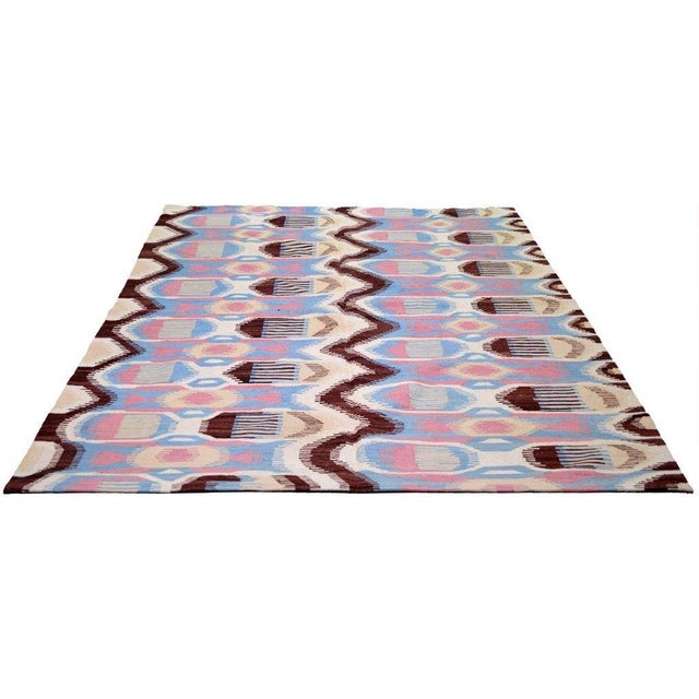 Hand-knotted with care using traditional rug-making techniques, this wool rug blends timeless craftsmanship with a modern...