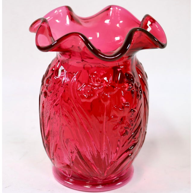 Bring a vibrant splash of traditional American craftsmanship to your tabletop with this striking vintage art glass vase by...
