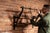 Substantial wall-mounted coat rack in a classic two-tier "firehouse" configuration, featuring turned wooden rails...