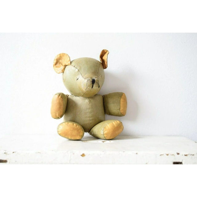 • Antique stuffed cloth teddy bear. • Lovingly handstitched with simple black thread eyes and nose. • Perfectly aged with...