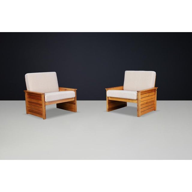 Pair of 1960s French Lounge Chairs in Solid Pine with New Cream Bouclé Upholstery A striking pair of vintage French lounge...