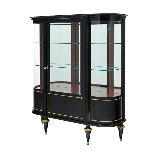 An exceptional French Louis XVI style vitrine or display cabinet, circa 1900, distinguished by its elegant neoclassical...