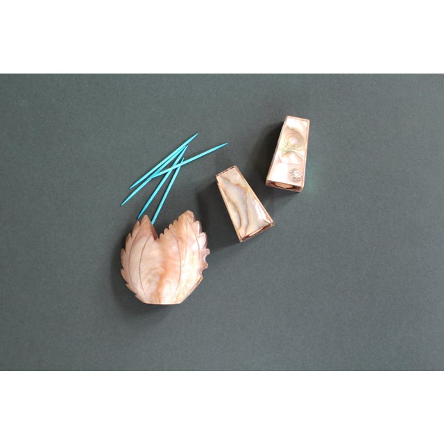 An awesome set of Mother of Pearl or Abalone Salt and Pepper Shakers. Souvenir shakers with Las Vegas, Nev printed tiny at...