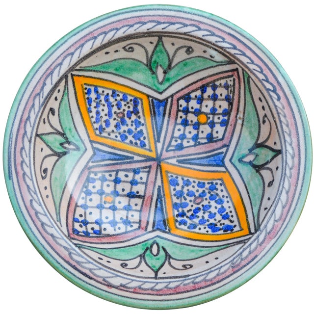 Handcrafted ceramic plate featuring an elaborate hand-painted Moorish pattern in a traditional Andalusian color...