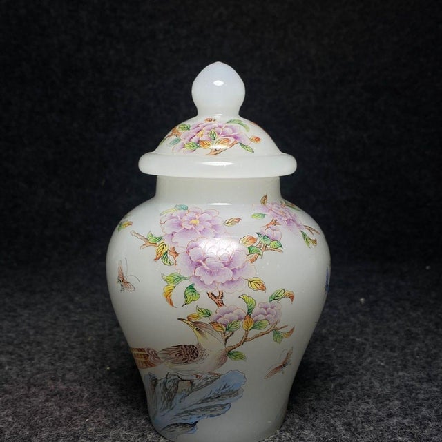 A lovely small Chinese Peking glass covered jar. The milky white glass is beautifully hand-painted with a vibrant pheasant...