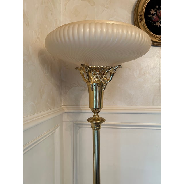Vintage Art Deco or Hollywood Regency Style Torchiere Floor Lamp. It features an ornate brass body with filigree crown...
