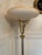 Vintage Art Deco or Hollywood Regency Style Torchiere Floor Lamp. It features an ornate brass body with filigree crown...