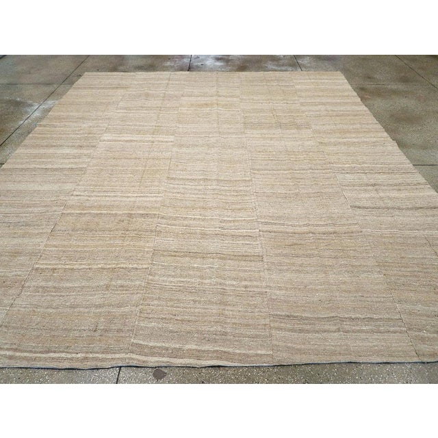 This Mid-20th century Turkish Flatweave Kilim rug, showcases the organic beauty and subtle artistry inherent to Anatolian...