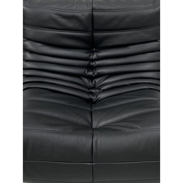 This Togo has been reupholstered with parts of new foam and leather, preserving its shape & iconic looks.The bottom could...