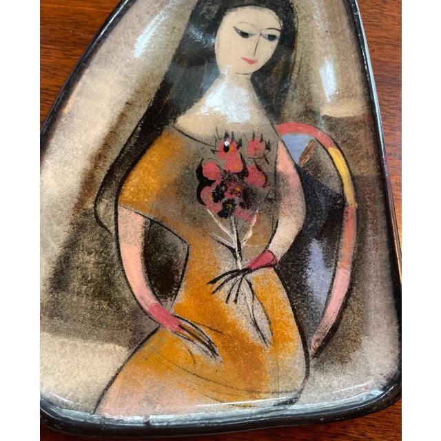 Polish-born Polia Pillin used engobe and glaze techniques to create mid-century motifs painted onto hand-thrown pottery...