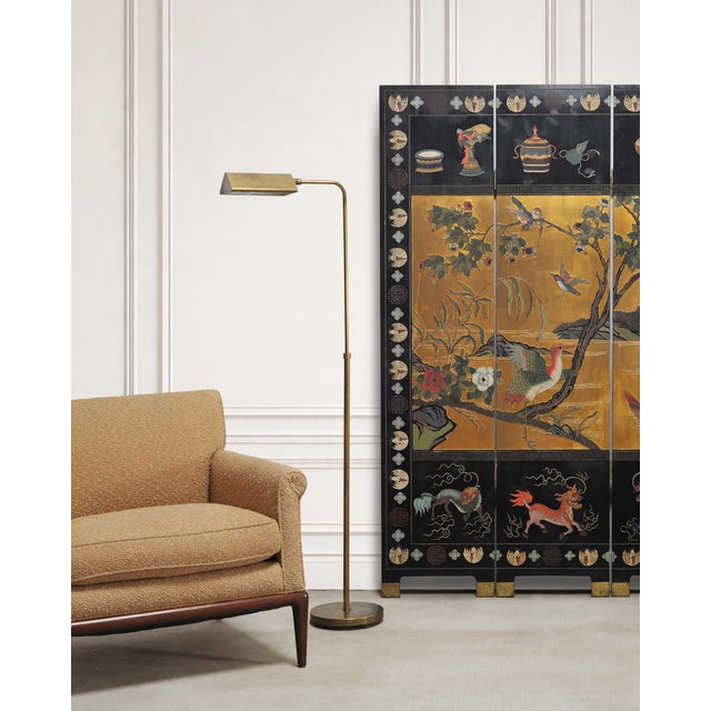 An aged and refined mid-century modern patinated brass pharmacy floor lamp made in the style and manner of similar lamps...