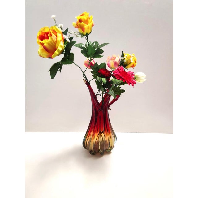 Made in Italy, 1960s. This vase is made in red, orange and yellow sommerso Murano glass, a beautiful combination that...
