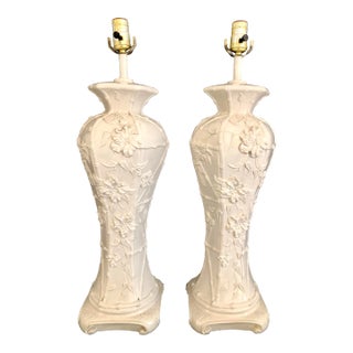 Pair of Chinoiserie Glazed Porcelain Lamps With Faux Bamboo and Floral Relief Accents For Sale