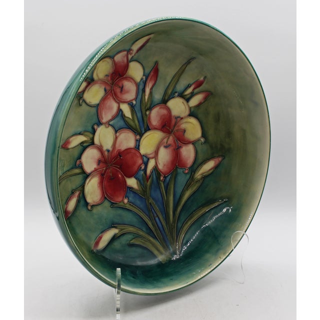 Circa 1935 deep centerpiece bowl in the “Freesia” pattern by Moorcroft, England. A gorgeous example made during the...