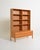 Oak bookcase composed of two stacked elements, with open shelves and a base with four drawers. Scandinavian production,...