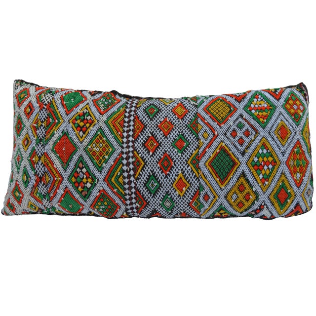 One-of-a-kind vintage Moroccan pillow handwoven by the Berbers of the High Atlas Mountains. Features ornate display of...