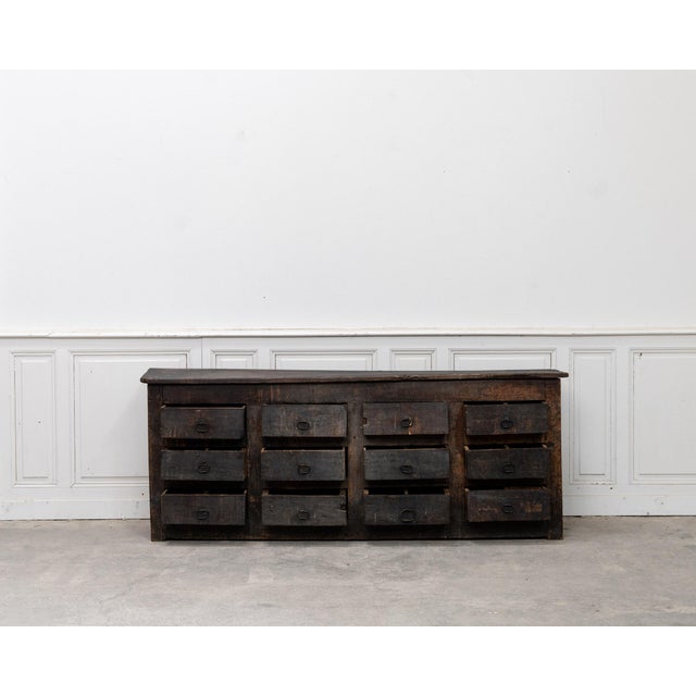 Exceptional primitive chest of drawers in solid oak dating from the 19th century. This Auvergne-style work chest is...
