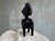 This striking vintage hand-carved wooden sculpture depicts a stylized female fertility figure inspired by the artistic...