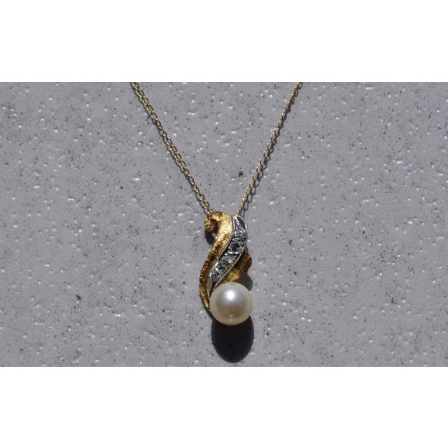 The Mueller: Vintage Pearl and Diamond Pendant. The pendant features a cultured pearl bottom with a slight rose overtone...