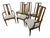 Elevate your dining space with this striking set of six Mid-Century Modern cane back dining chairs. Crafted with sleek...