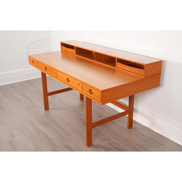 Danish teak "flip-top" partners' desk by Peter Løvig Nielsen for Løvig. This piece offers ample storage for all of your...