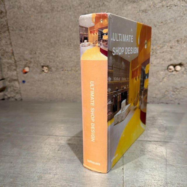 For your consideration, a hardcover book "Ultimate Shop Design" published by teNeues.It was edited by Llorenc Bonet...