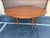 Beautiful and rare large oval drop leaf walnut dining table. The stunning MCM dining table from Heritage Henredon is a...