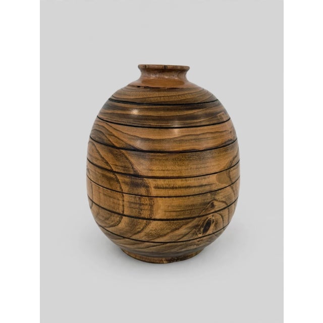 A striking example of American studio woodturning, this hand-turned vessel is crafted from solid white oak with a dramatic...