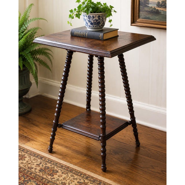 A charming antique oak lamp table dating to the late Victorian/early Edwardian period, circa 1900. This elegant piece...