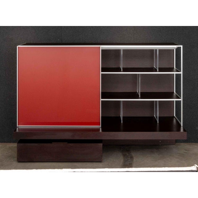 Antonio Citterio for B&B Italia "Domus 03" Wall Unit, wood and steel frame with red acrylic sliding door opening to multi-...