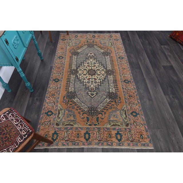 Vintage Turkish Oushak Handwoven Area Rug is a semi-antique vintage rug. '60s Western region of Turkey's unique rug is...