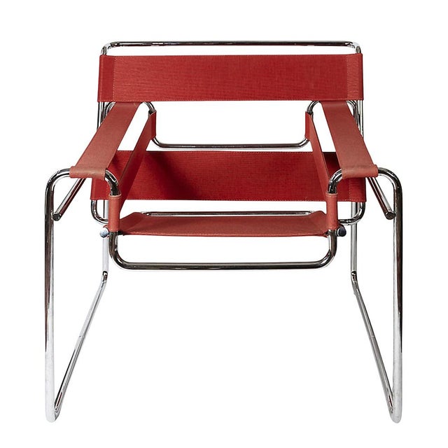 Wassily lounge chair, designed by Marcel Breuer, circa 1925. In red canvas upholstery, chromed steel tube frame....