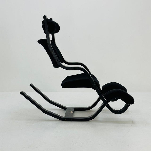 Mid century black fabric Gravity” rocking Lounge chair by Peter Opsvik for Stokke, 1980s Unique relax chair. Beechwood...