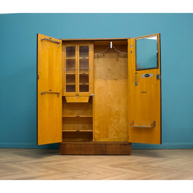 A vintage Oak Art Deco compactum / compact wardrobe Made by Compactum, circa 1930's Inside is beautifully fitted out with...