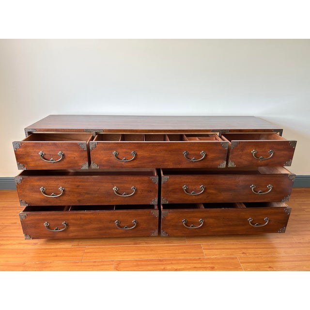 Henredon walnut chest of drawers. Seven dovetail drawers in various sizes. Top center has removable dividers and a jewelry...