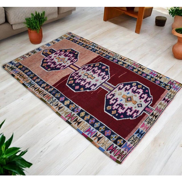 This hand-knotted vintage area rug originates from Southeastern Anatolia, meticulously crafted during the 1970s. Featuring...