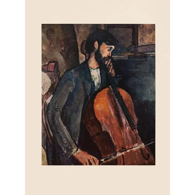 An excellent vintage First Edition full-color print after painting "The Cellist" (Study, 1909) by Amedeo Modigliani. Comes...