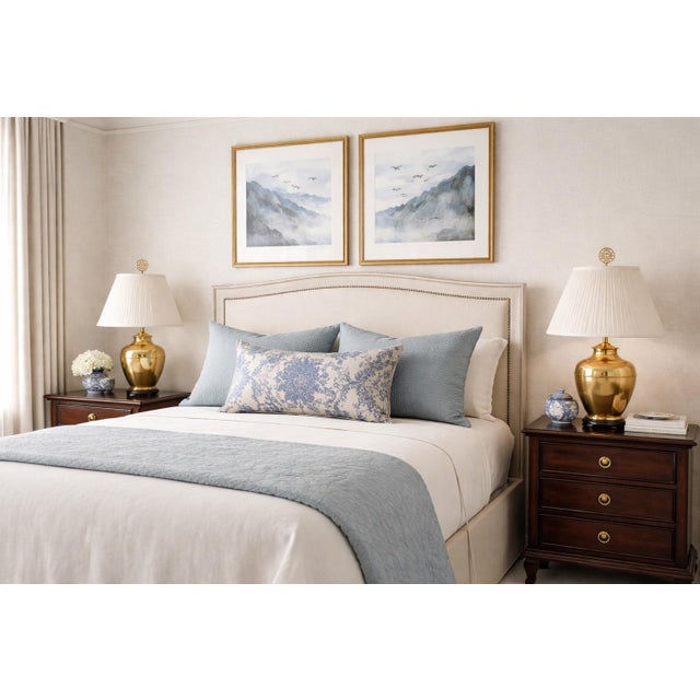 This elegant pair of vintage brass ginger jar table lamps showcases classic Chinoiserie-inspired styling with clean,...